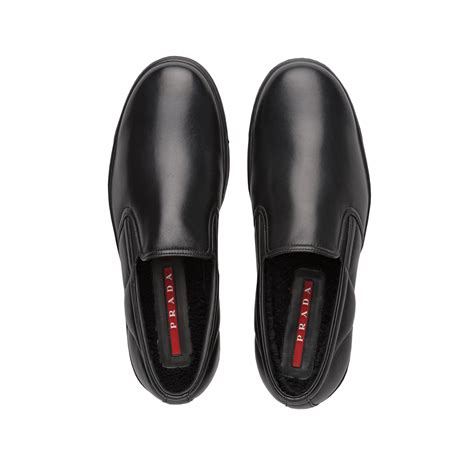 prada men's leather slip-ons|farfetch prada slip on.